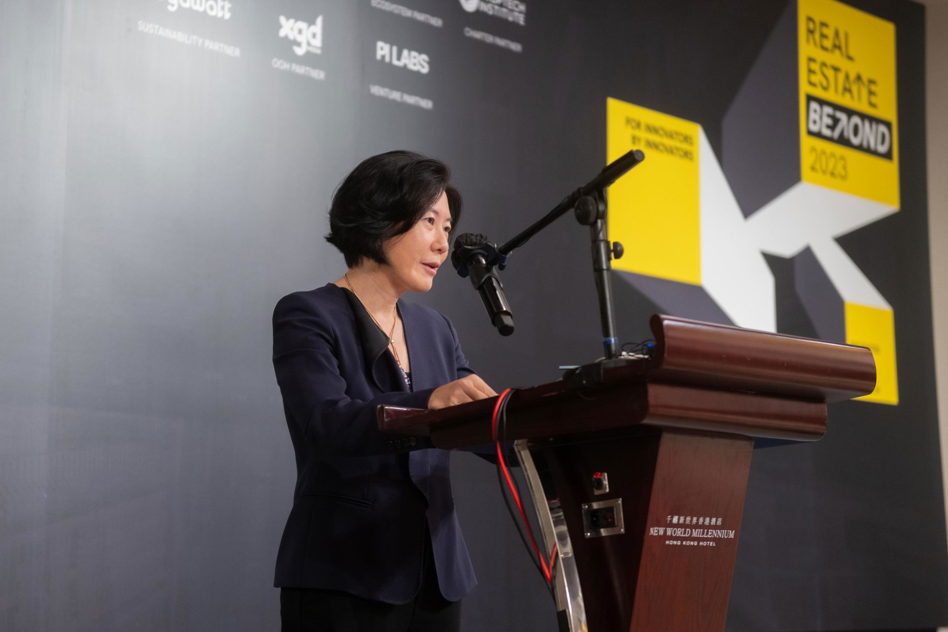 Photo shows the Director-General of Investment Promotion, InvestHK, Ms Alpha Lau, delivering opening remarks at Real Estate Beyond 2023.